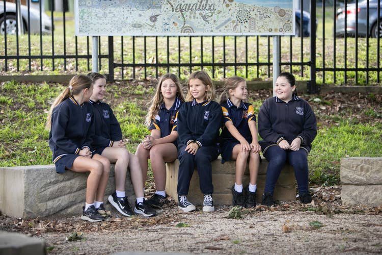 Students talking in yarn circle.