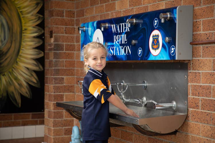 Student drinking from bubbler.