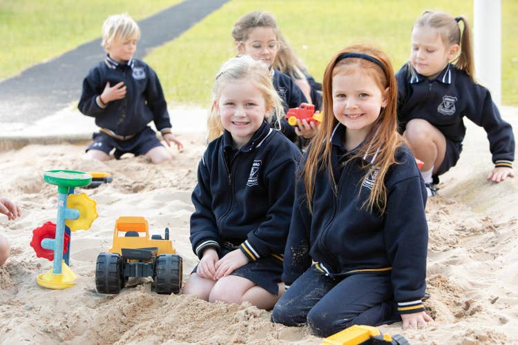 Students playing in sandpit