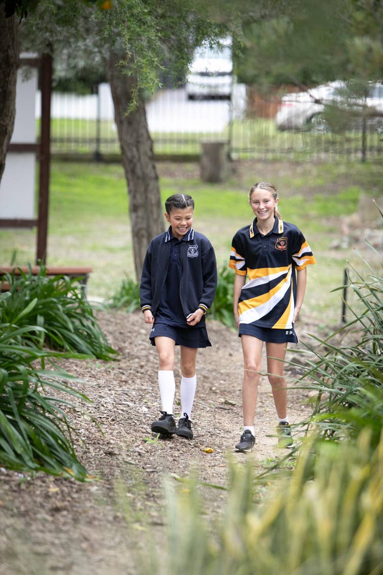 Students walking in outdoor environment